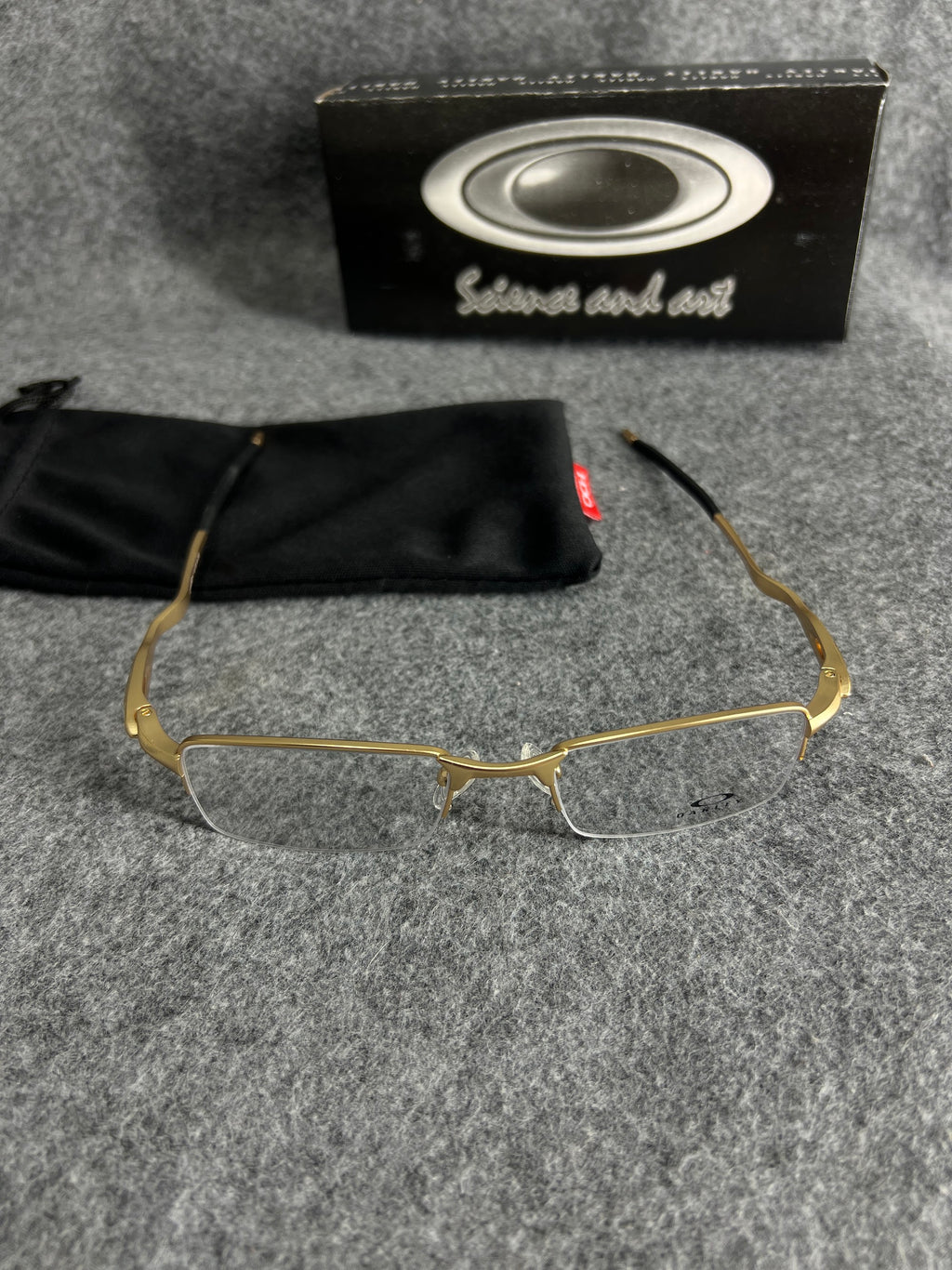 Armação Oakley Lente Transparente Dourada