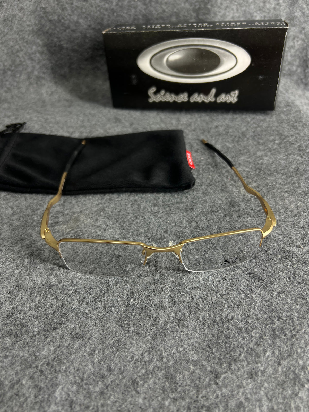 Armação Oakley Lente Transparente Dourada