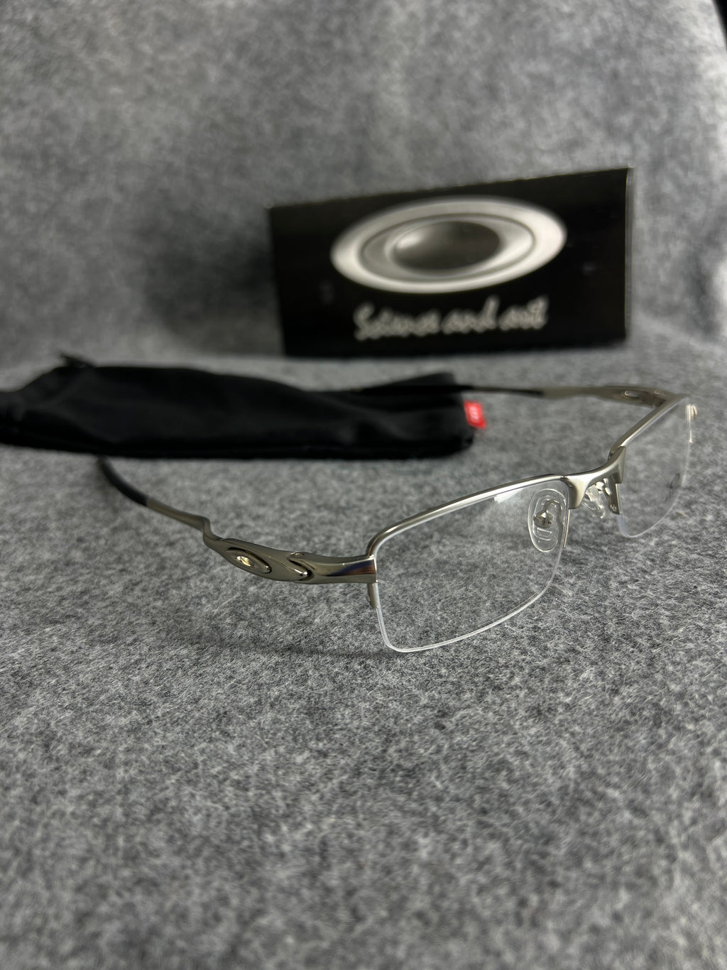 Armação Oakley Lente Transparente Prata
